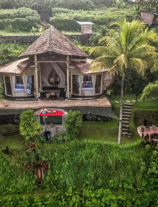 camaya bali butterfly house bamboo drone shot flower bath jacuzzi girl