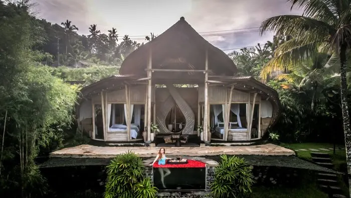 camaya bali butterfly house bamboo drone shot flower bath jacuzzi girl